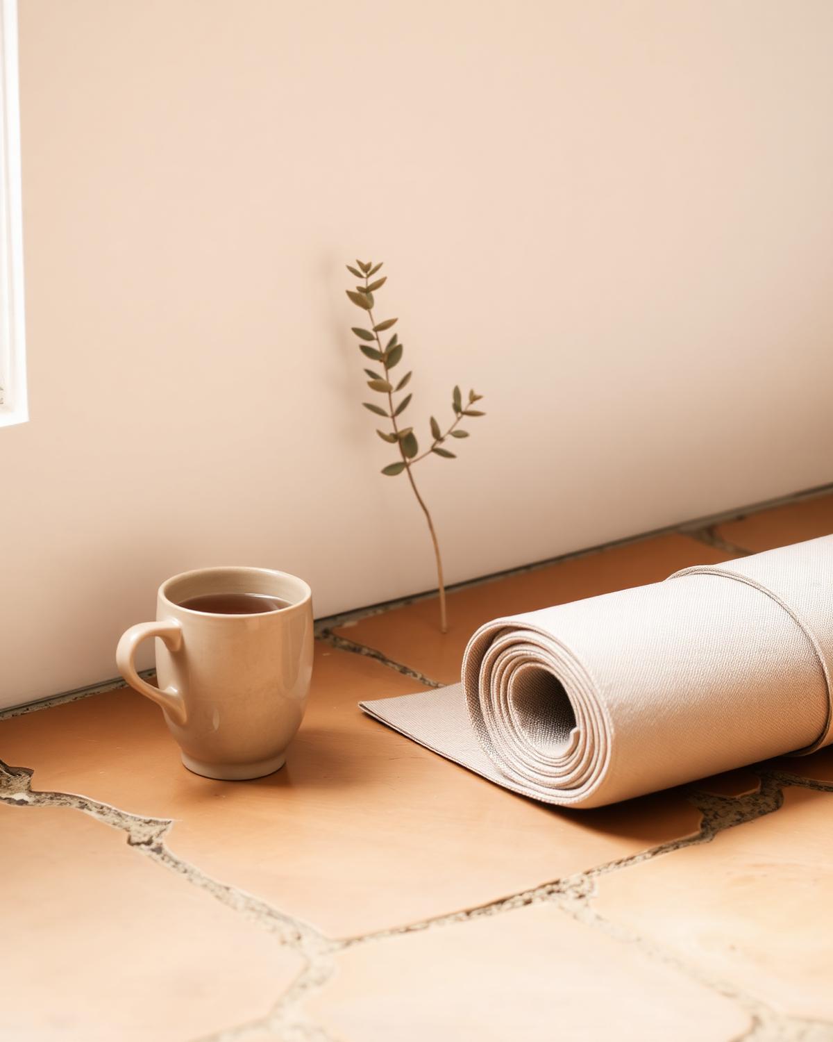 Serene still life with tea and yoga mat